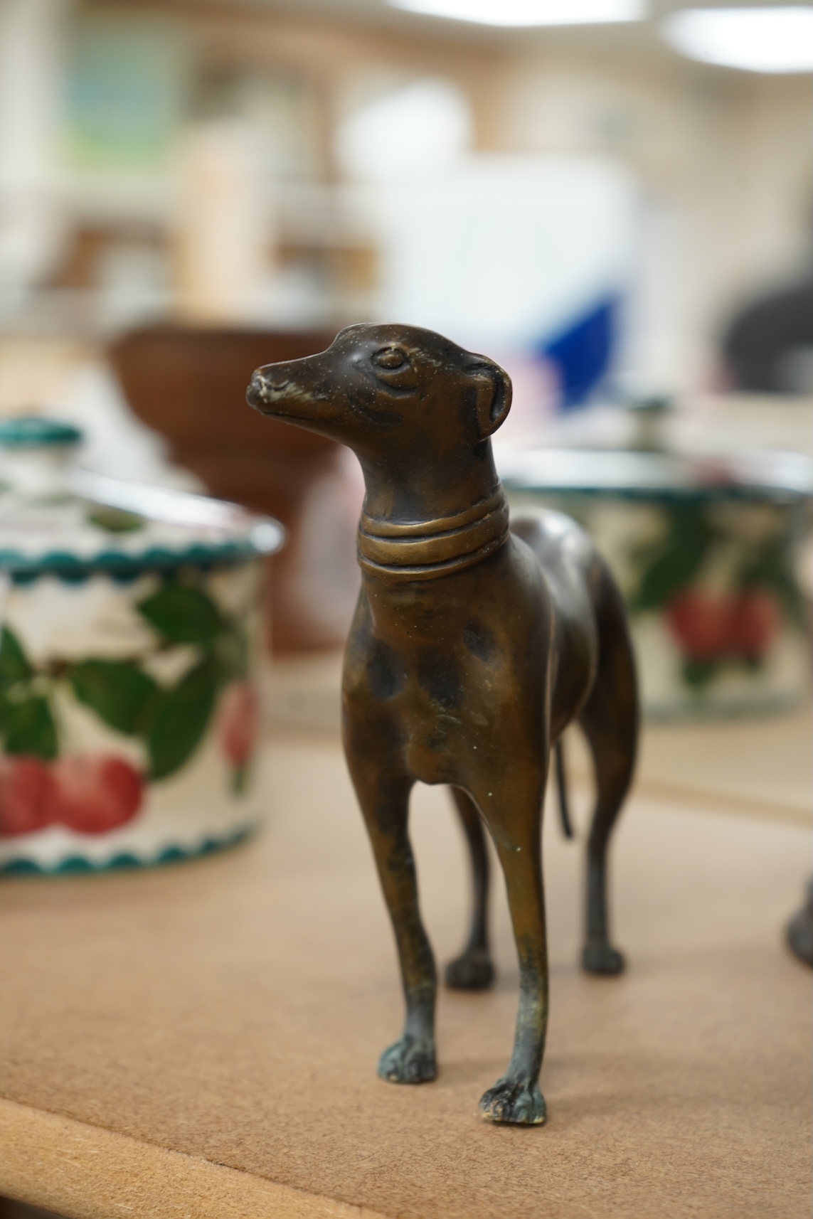 A bronzed metal model of an elephant and a bronze model of a greyhound, tallest 20cm